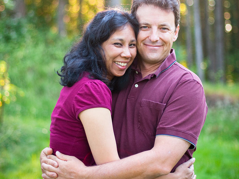 Casual Loving Husband and Wife Multi Racial Couple Portrait 