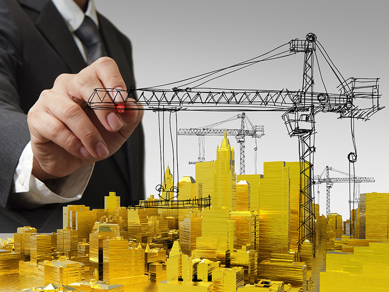 business man hand draws golden building development concept