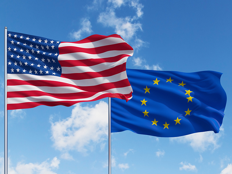 two flags of usa and European Union on a sky background