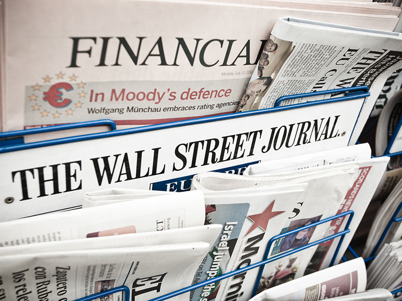 Financial Newspapers on a Newsstand