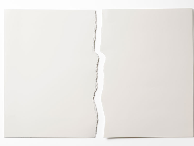 Isolated shot of torn white paper on white background