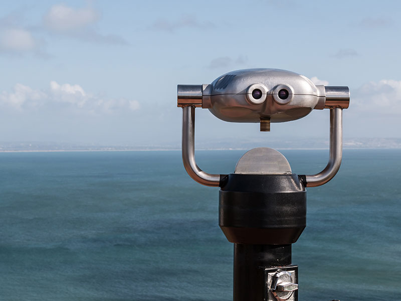 Sightseeing Binoculars Overlooking Ocean From Up High