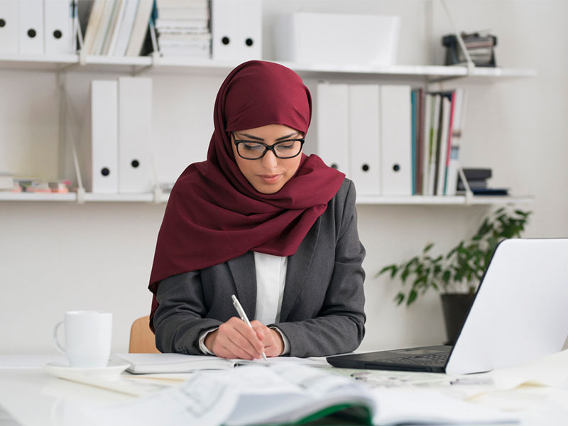 Portrait of a muslim businesswoman working at her office