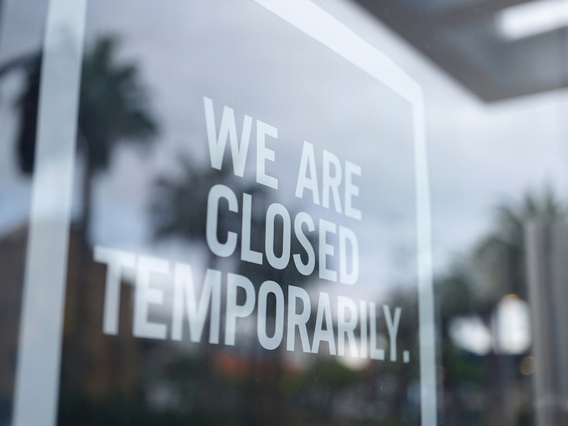 shot of store closed sign