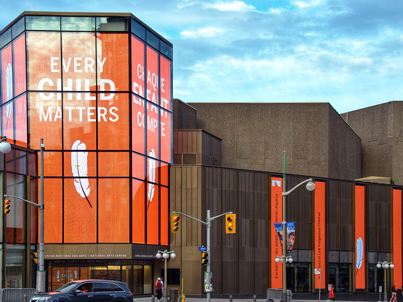 Ottawa; July 1, 2021: The National Arts Centre displays a message of support for the cause of reconciliation after the unmarked graves of Indigenous children who attended residential schools were found.