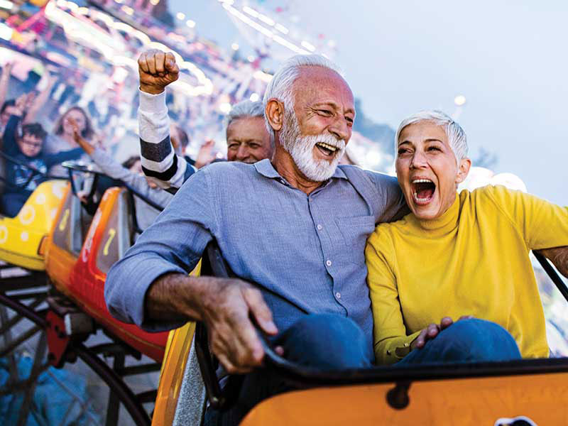 senior couple on a rollercoaster