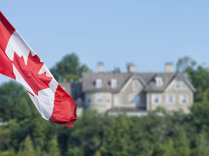 Canadian flag in front of 24 Sussex Drive