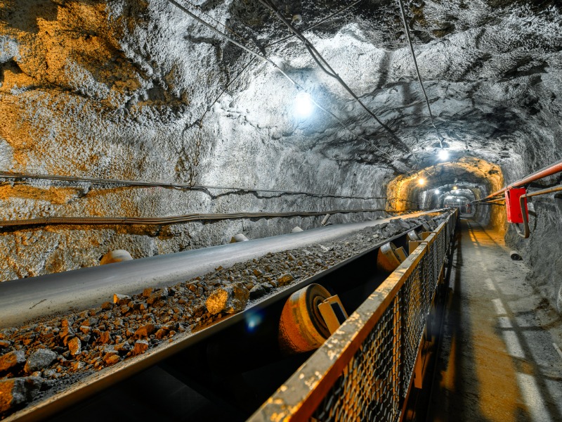 Belt conveyor in an underground tunnel. Transportation of ore to the surface stock photo