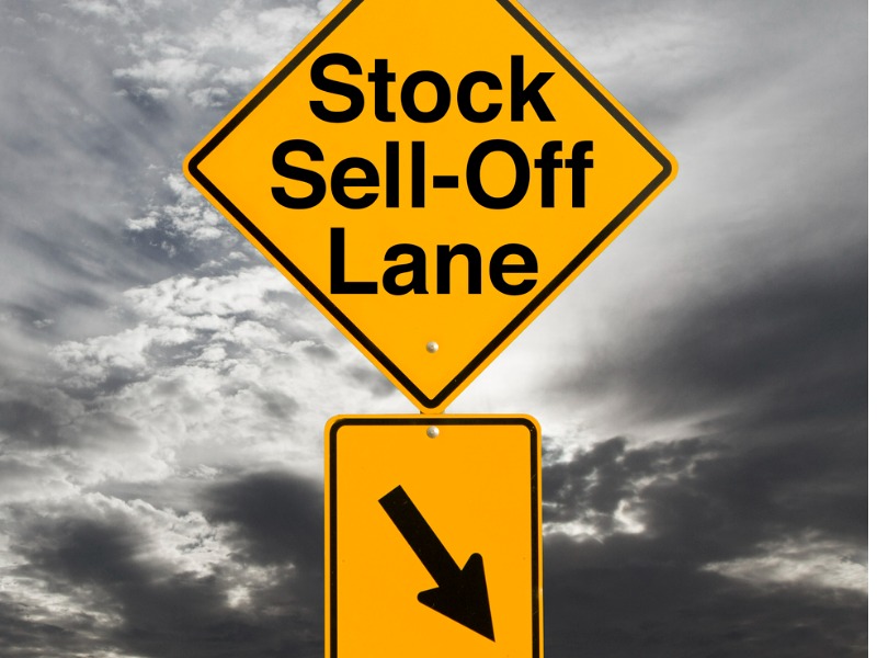 A sign that says "Stock Sell-Off."