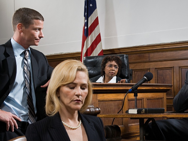 A lawyer questioning a suspect stock photo