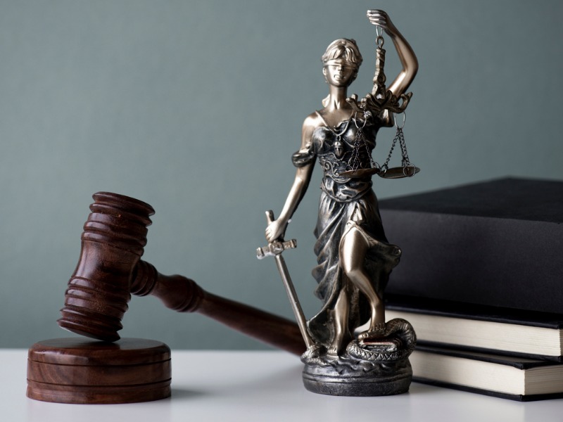 Lady justice, gavel and law books.