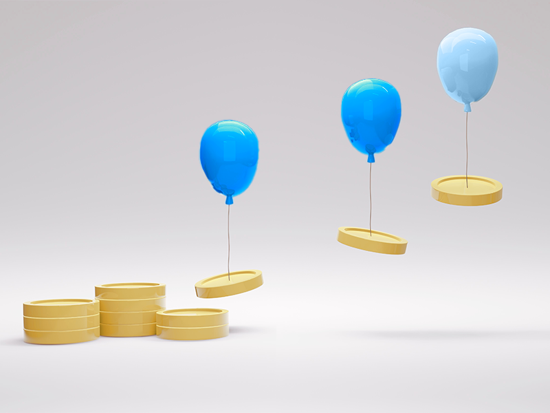 3 floating blue balloons tied to coins