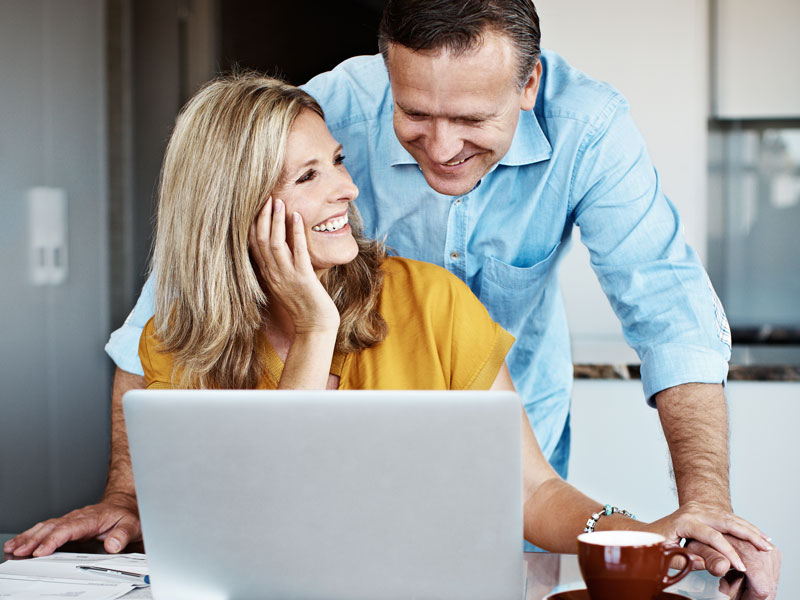 Couple happily reviews their finances.