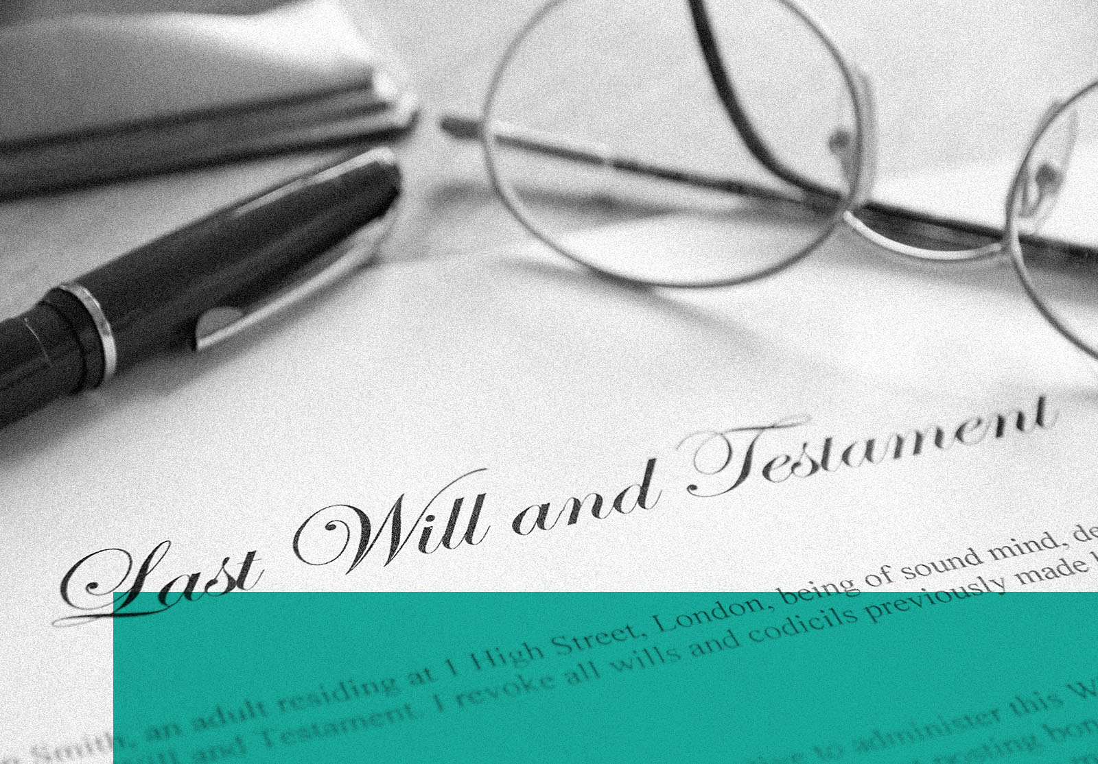Last Will and Testament with spectacles and pen.